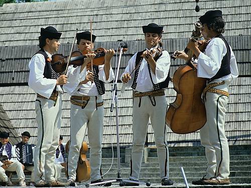 The brothers' Mucha Music of Terchová performing at the Folk Festival underneath Polana, Detva