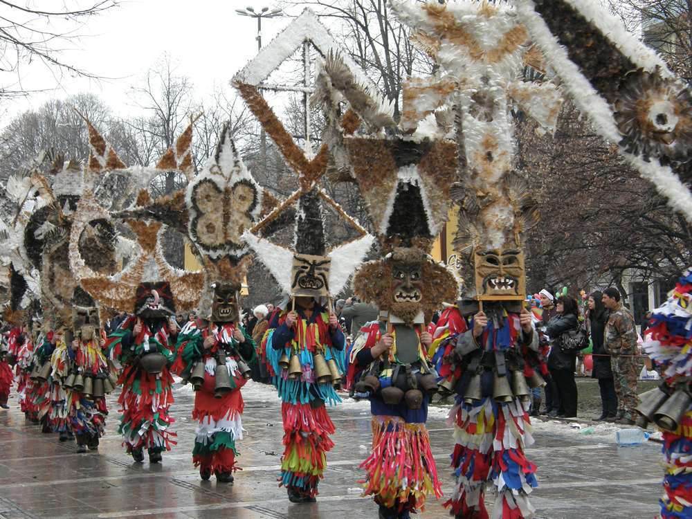 A masquerade group in the Bulgarian village of Meshtitsa at the International Festival of masquerade games 'Surova', Pernik. The masks are made of bird wings and feathers, the costumes are made of fabric cut into fringes