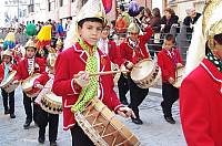 Boys and girls from the 'turba coliblanca' (with-maned group), Baena (Córdoba), playing their drums during Holy Week. They wear a metal helmet with a white horse's mane hanging from it, which is their symbol of identification