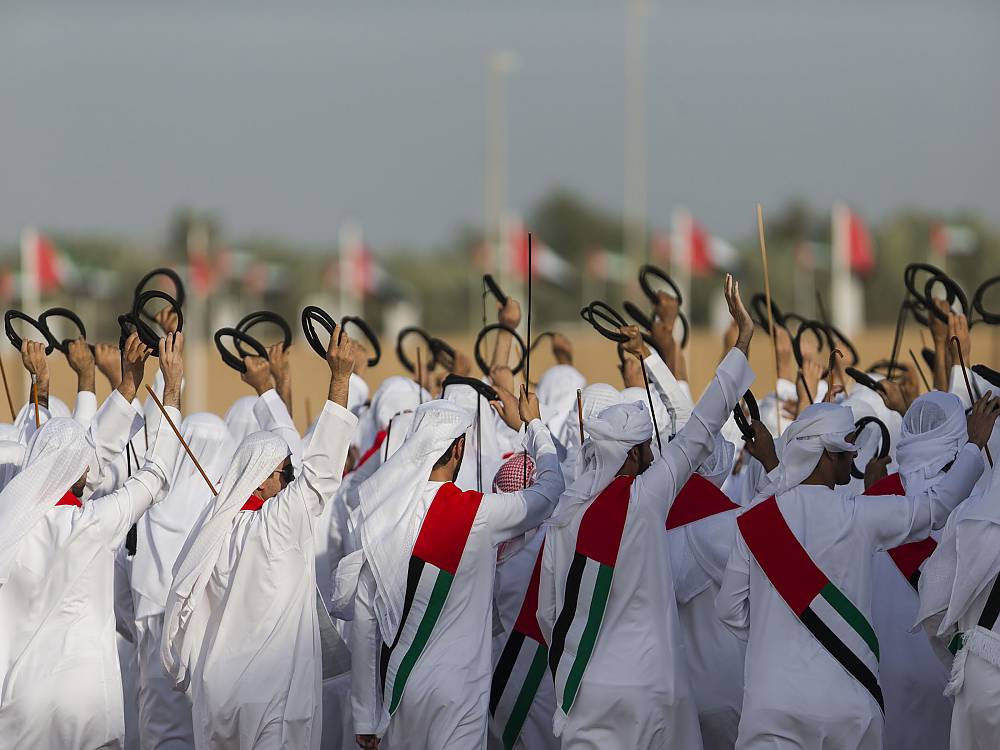 UAE citizens showing Al A’zi in a parade during the 44th National Day