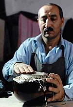 Art of crafting and playing with Kamantcheh/Kamancha, a bowed string musical instrument