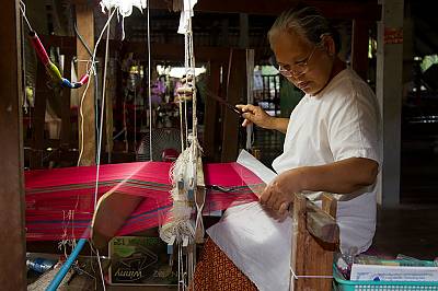 A silk weaver in Surin Province, Thailand