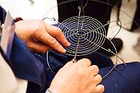 Wire craftsman Jozef Zoller from Leopoldov making the base for wire bowl