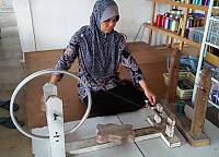 Unwinding the hanks and winding the threads on to the bobbins or spools