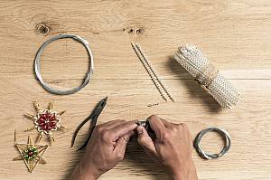 Handmade production of Christmas tree decorations from blown glass beads