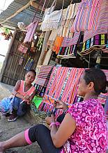 Various Tais sold in a local market. It is common for women weavers to sell Tais to gain additional income for the family.  Read more on the element