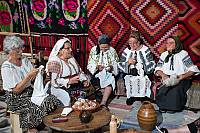 Women from Cezieni sewing blouses with embroidery on the shoulder (altiţă), Romania