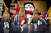 Jiyeon Gwangdae's dance at the Yechoen Cheongdan Noreum. Four Jiyeon Gwangdaes, wearing masks made from winnows, symbolize the four directions (NSEW) and four seasons.