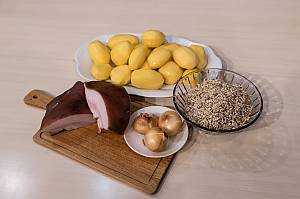 Cooking and eating Mulgi puder, traditional mashed potato with barley in the Mulgimaa region, Estonia
