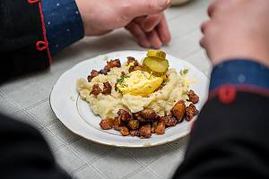 Cooking and eating Mulgi puder, traditional mashed potato with barley in the Mulgimaa region, Estonia