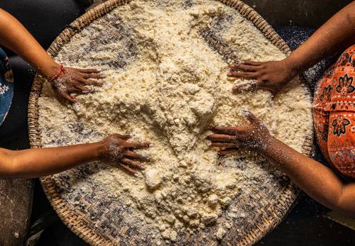 Juana Lopez sifting the cassava flour in the hibise (big sifter), Santa Fe Municipality, Colon Department, Honduras