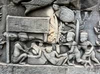 The bas-relief of Bayon temple, end of 12th beginning of 13th century, displays a man wearing a Krama on his shoulder