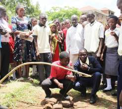 Young people playing the Omusokolome, an important but dying music instrument in Busoga
