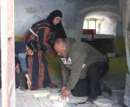 A Palestinian family making Nabulsi soap at home: Mr Khaled Omar Diab and his wife, Mrs Ferial Daoud, from Mazre' Al-Nobani village