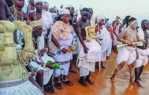 The bearing of the sacred stone or the rites of the New Year in the Guin country in Togo