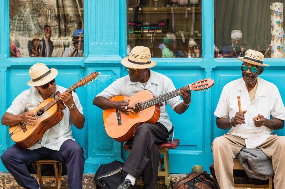 Havana, Cuba - March 24, 2017: Elderly street musicians playing traditional cuban music on the street in old Havana